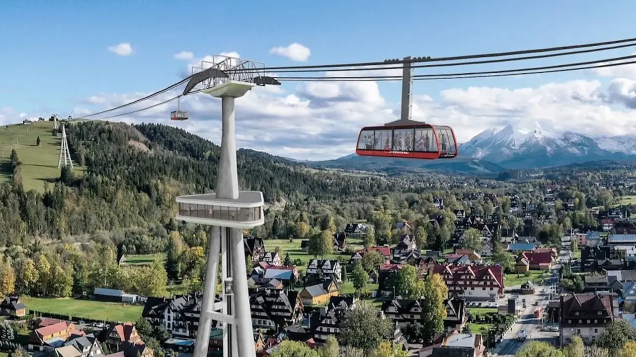 Nowe atrakcje Białki Tatrzańskiej i okolice: kolejka linowa z widokiem na Tatry, nowoczesna wieża widokowa i malownicze domy.